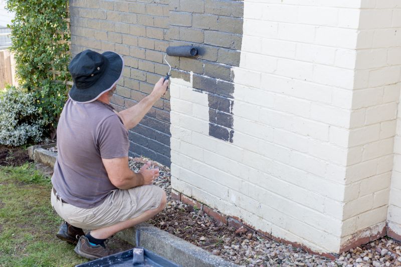 Handyman painting a wall
